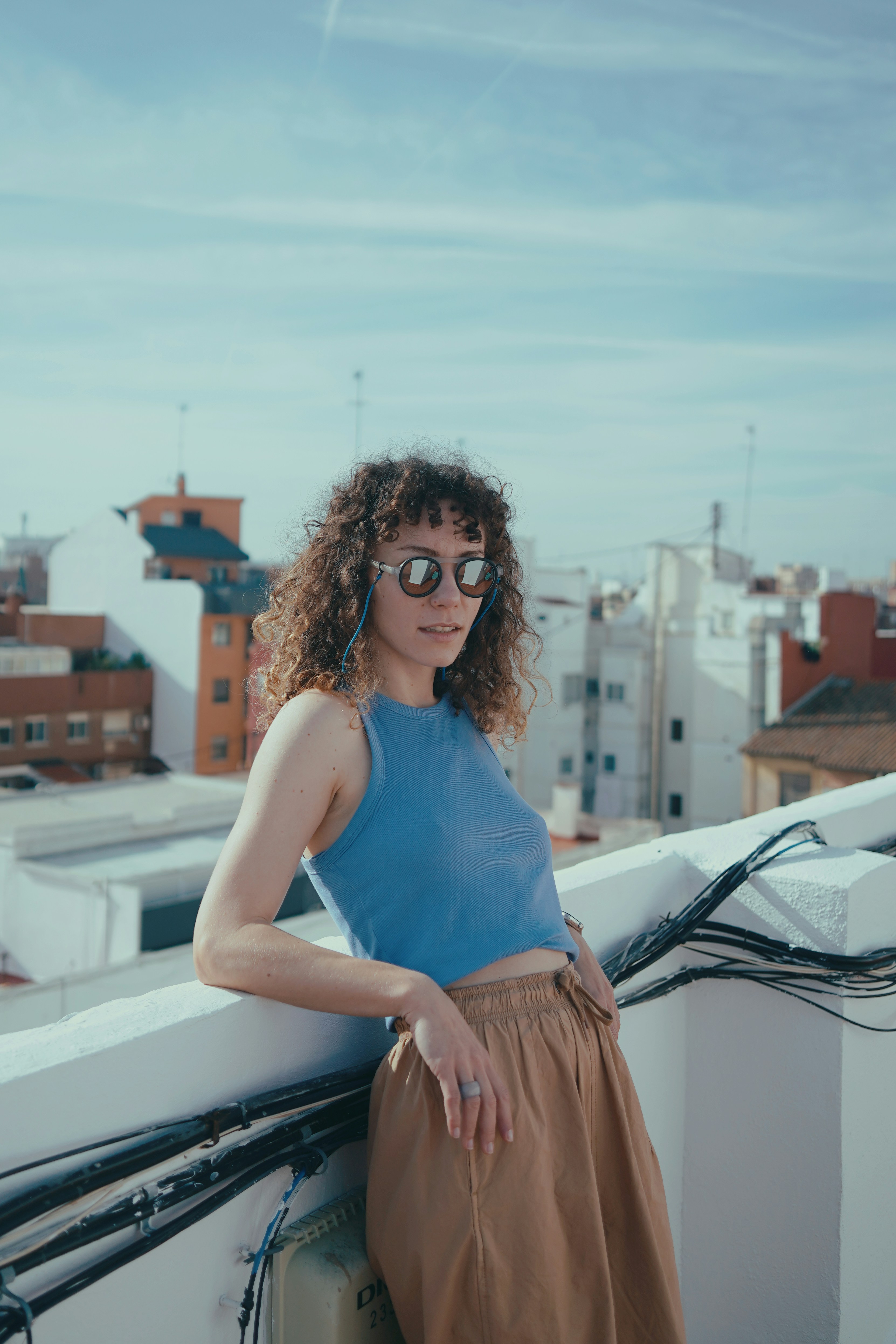 a woman standing on top of a roof