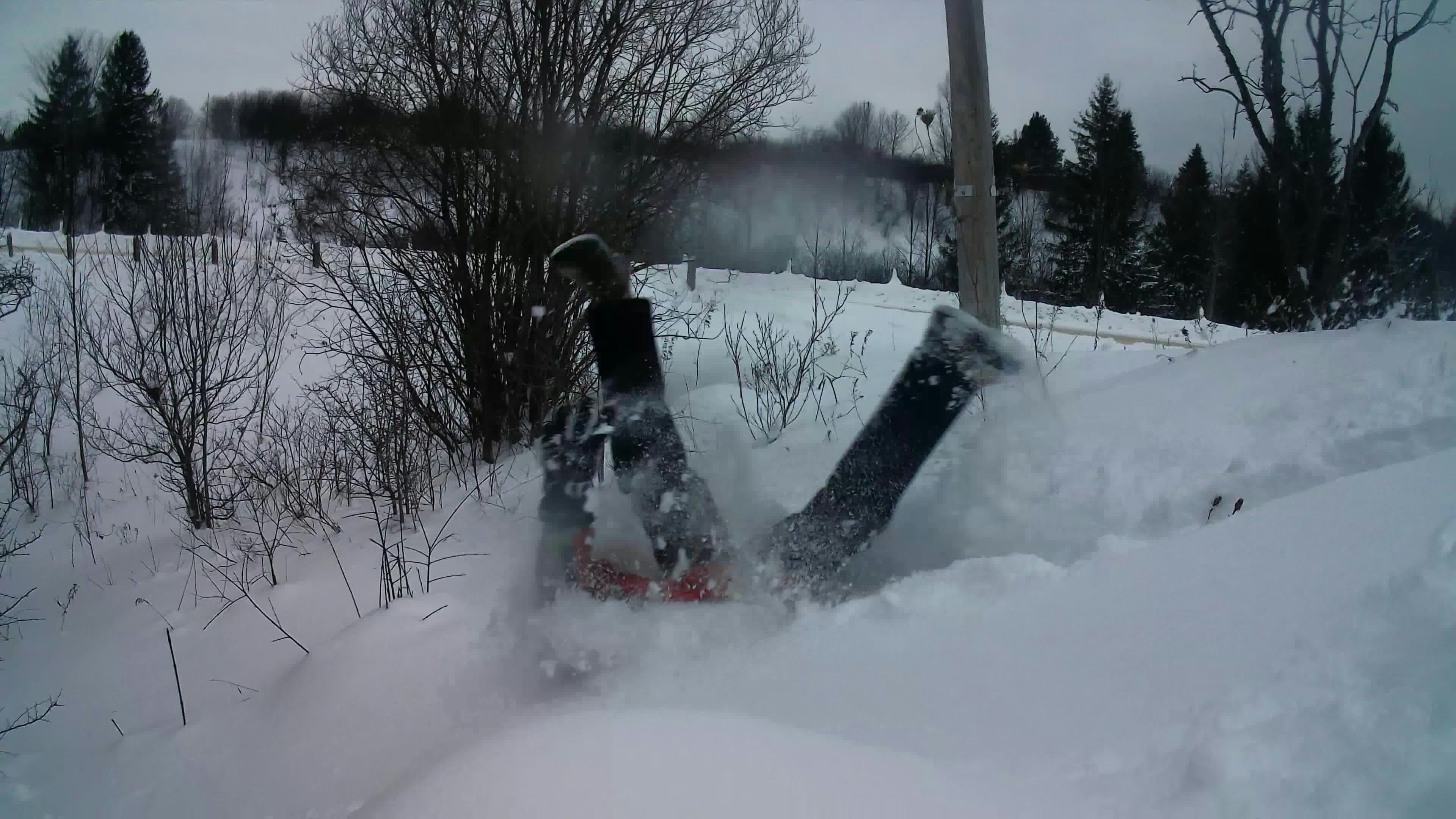 a snowboard that is laying in the snow