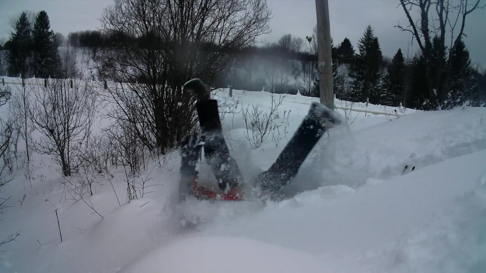 a snowboard that is laying in the snow