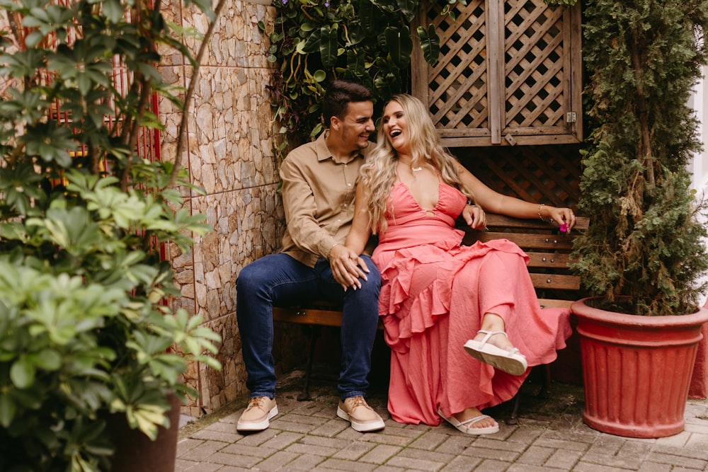 a man and a woman sitting on a bench