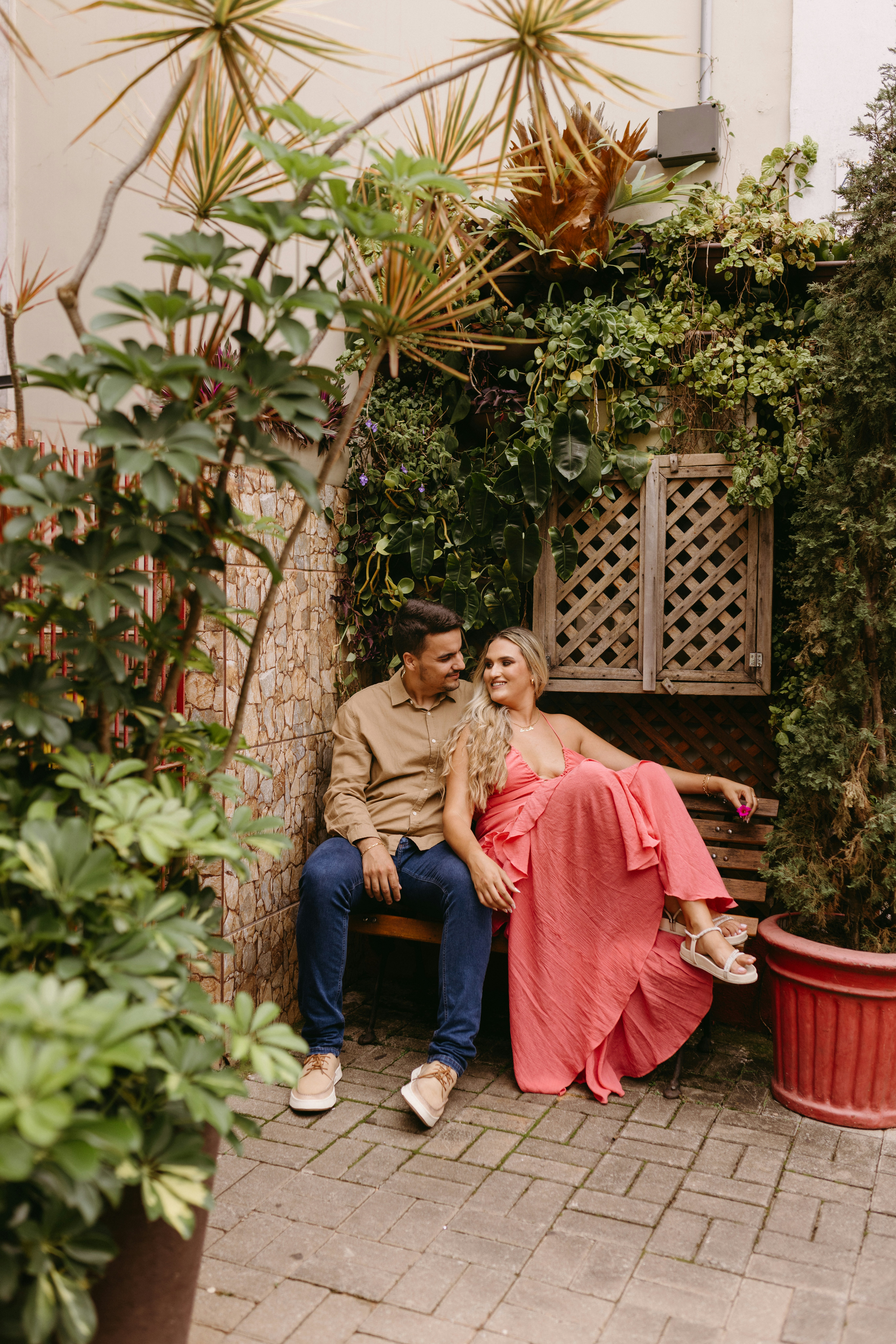 a man and a woman sitting on a bench