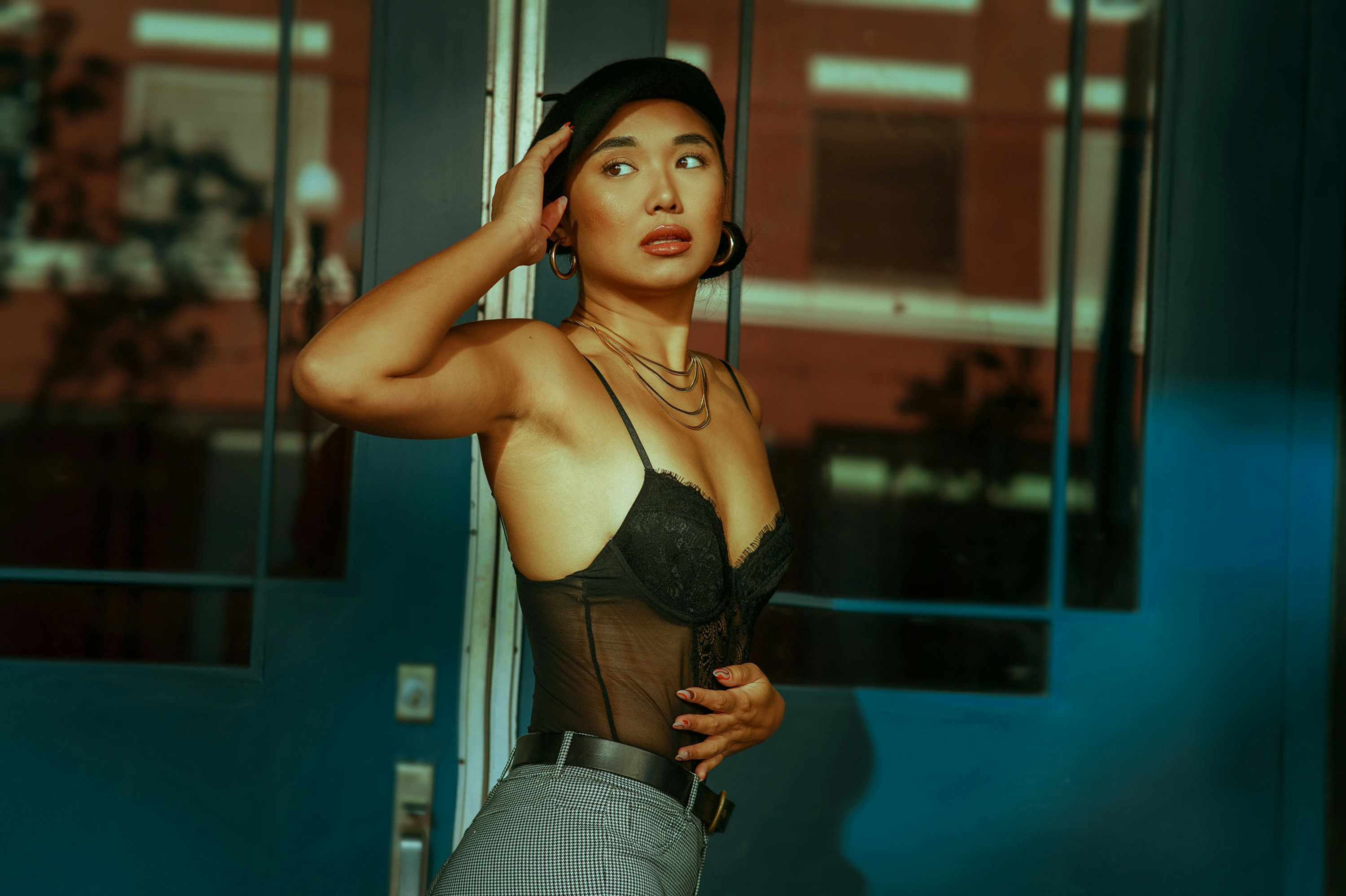 a woman in a black bra top and skirt