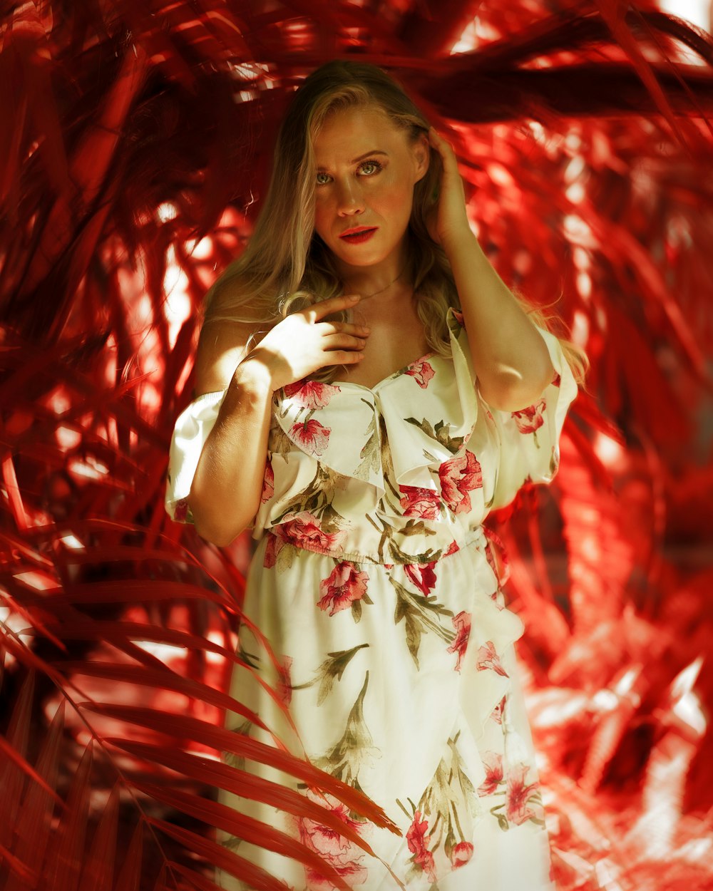 a woman in a white dress is posing for a picture