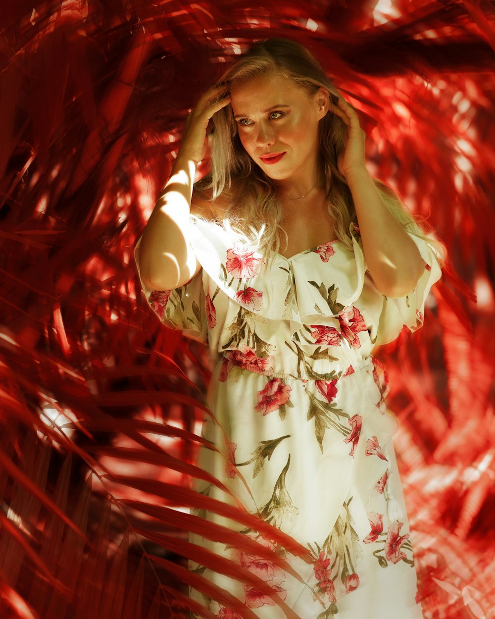 a woman in a white dress is posing for a picture