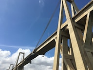 a view of a very tall bridge with a sky background