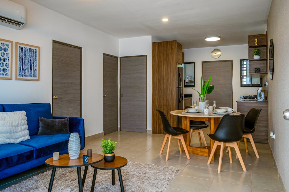 a living room filled with furniture and a blue couch