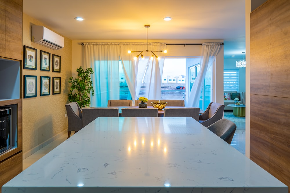 a kitchen and living room with a large table