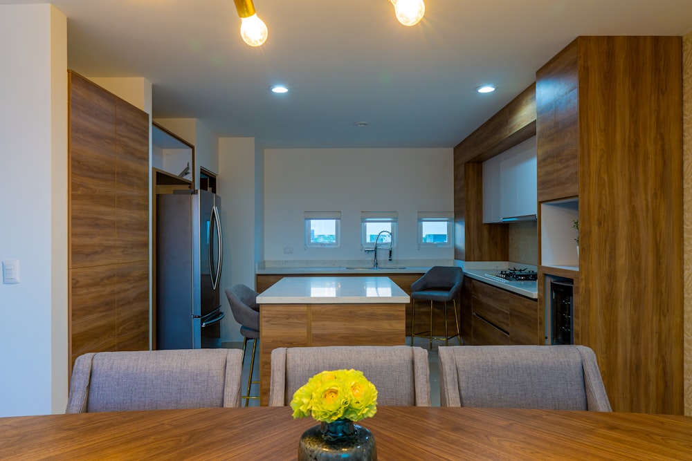 a kitchen and dining room with a table and chairs