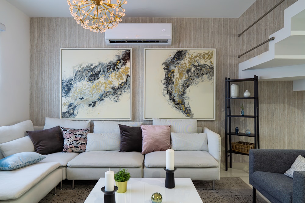 a living room filled with furniture and a chandelier