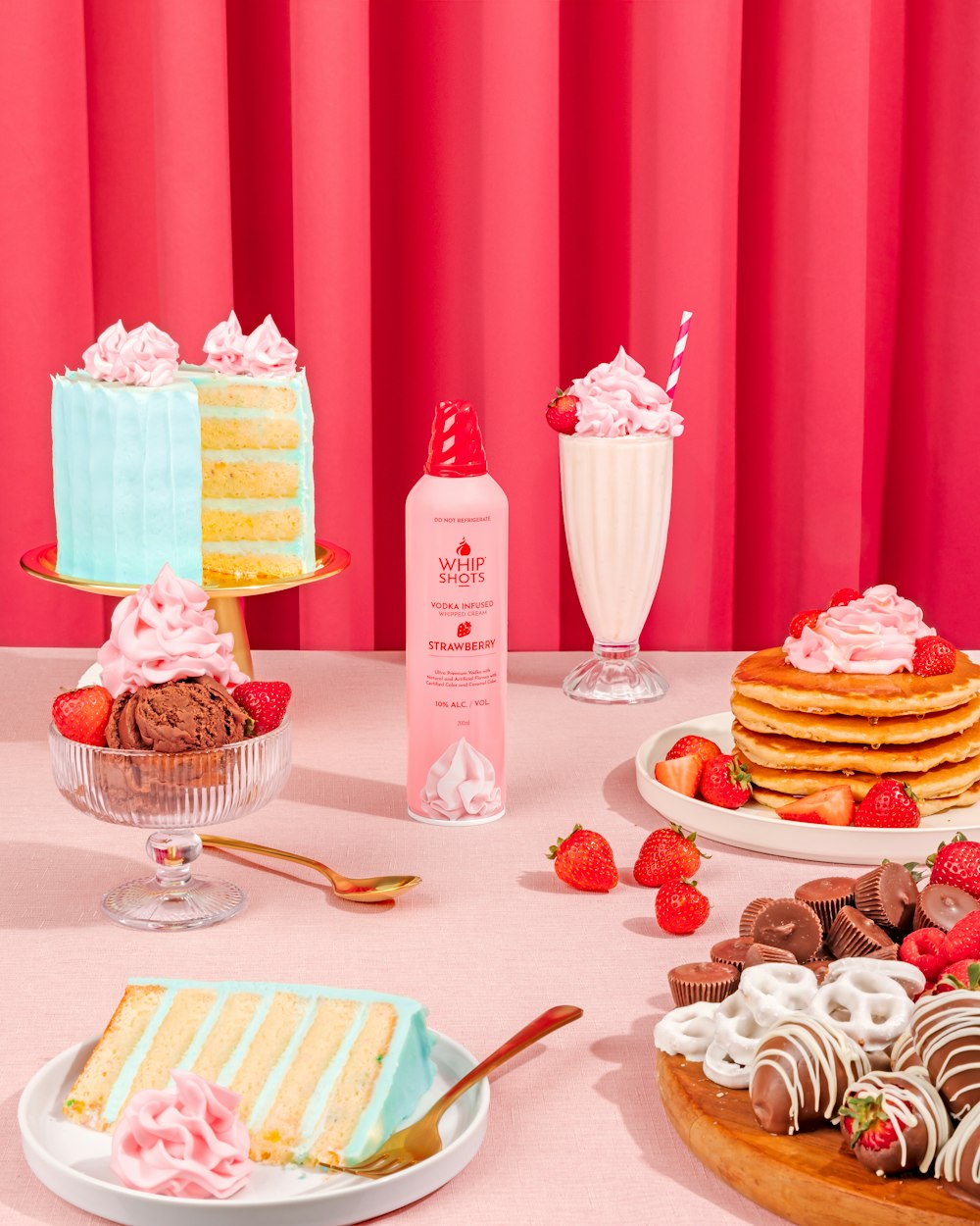 a table topped with lots of cakes and desserts