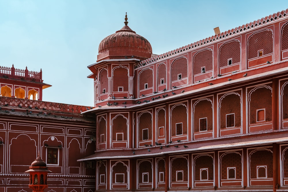 a red building with a dome on top of it