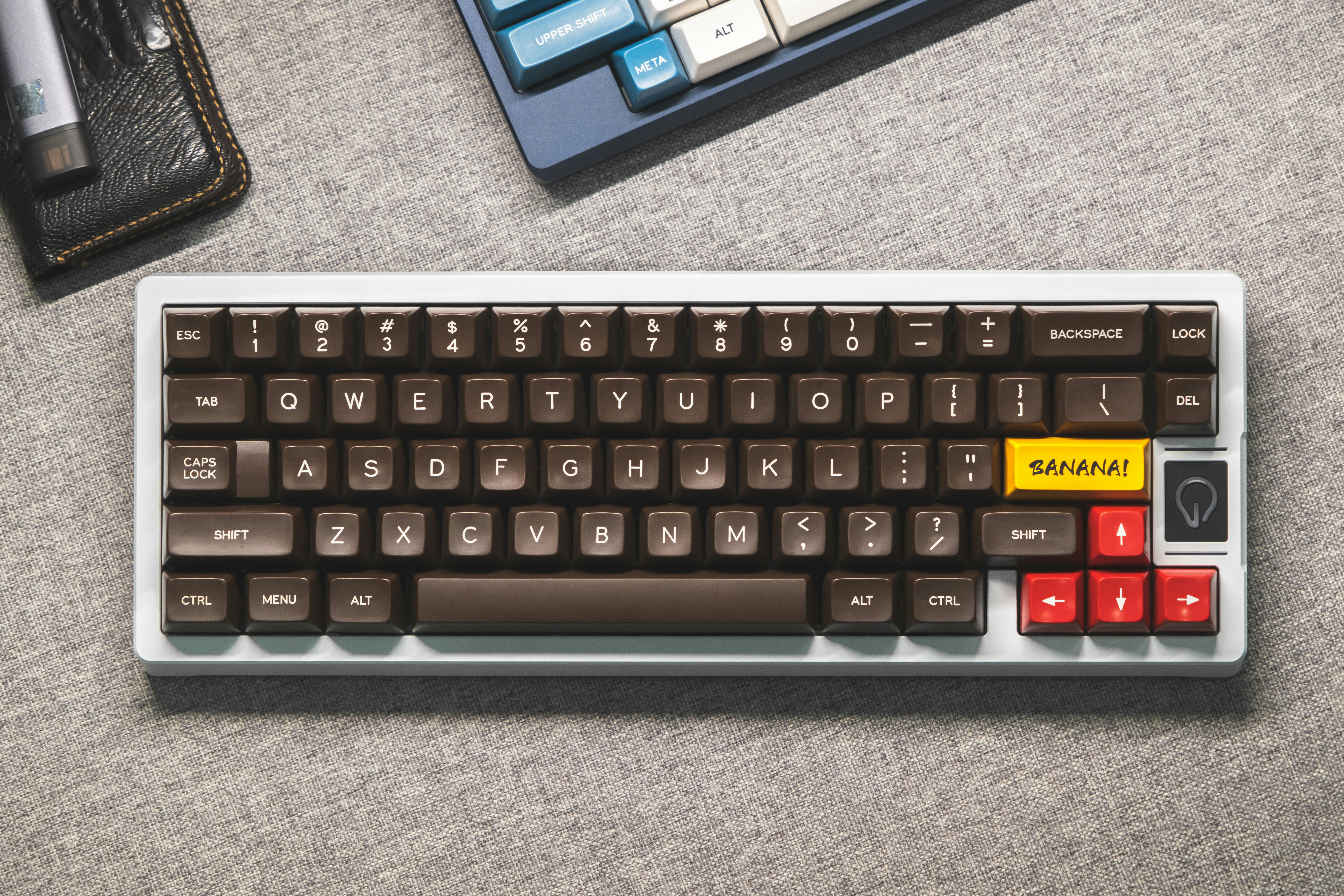 a computer keyboard with a yellow sticker on it