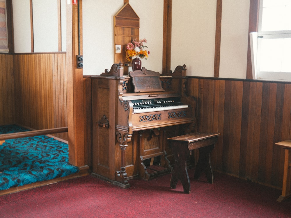 a piano in a room with wooden paneling