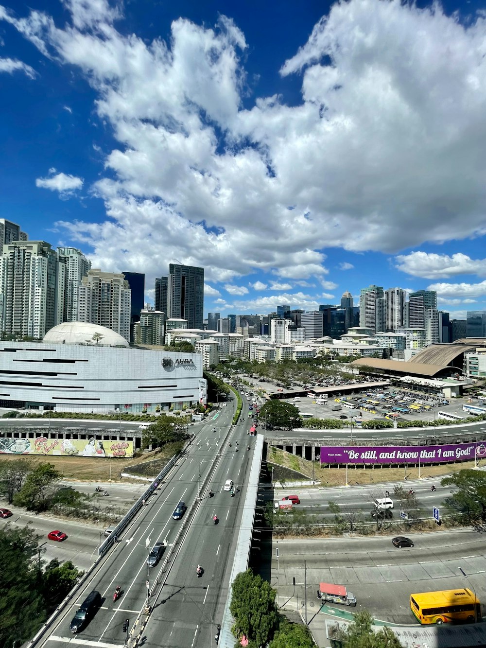 an aerial view of a city with tall buildings