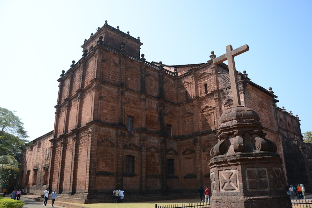 a large building with a cross on top of it