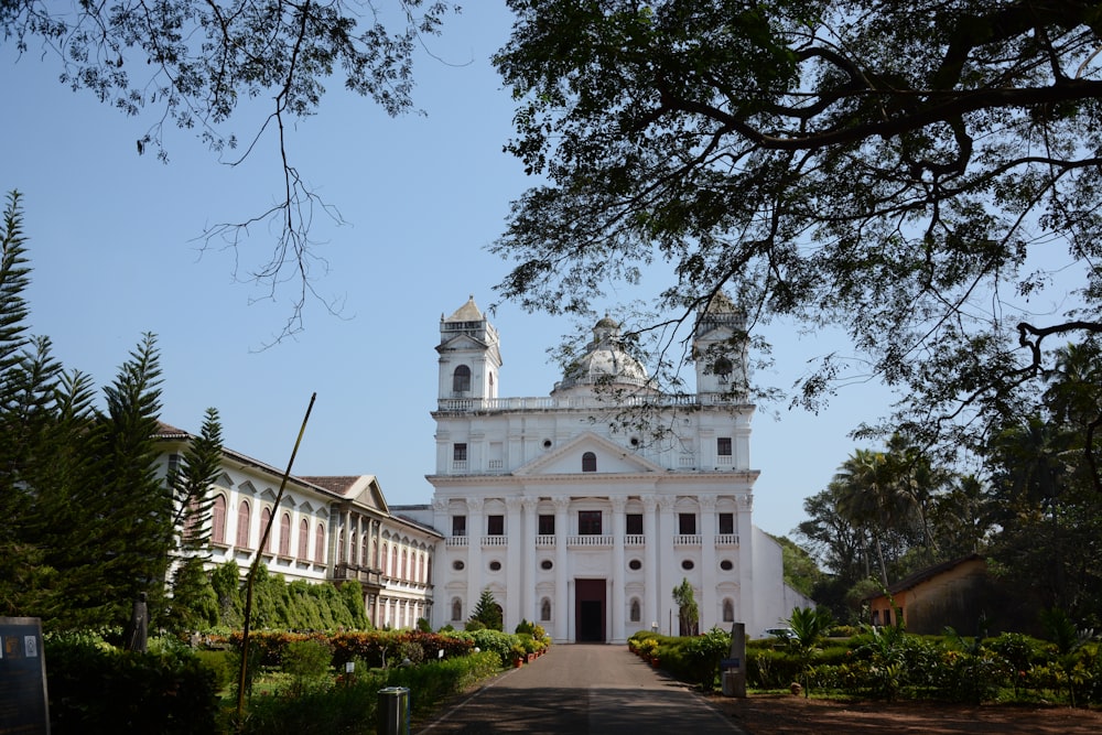 a large white building with a clock tower