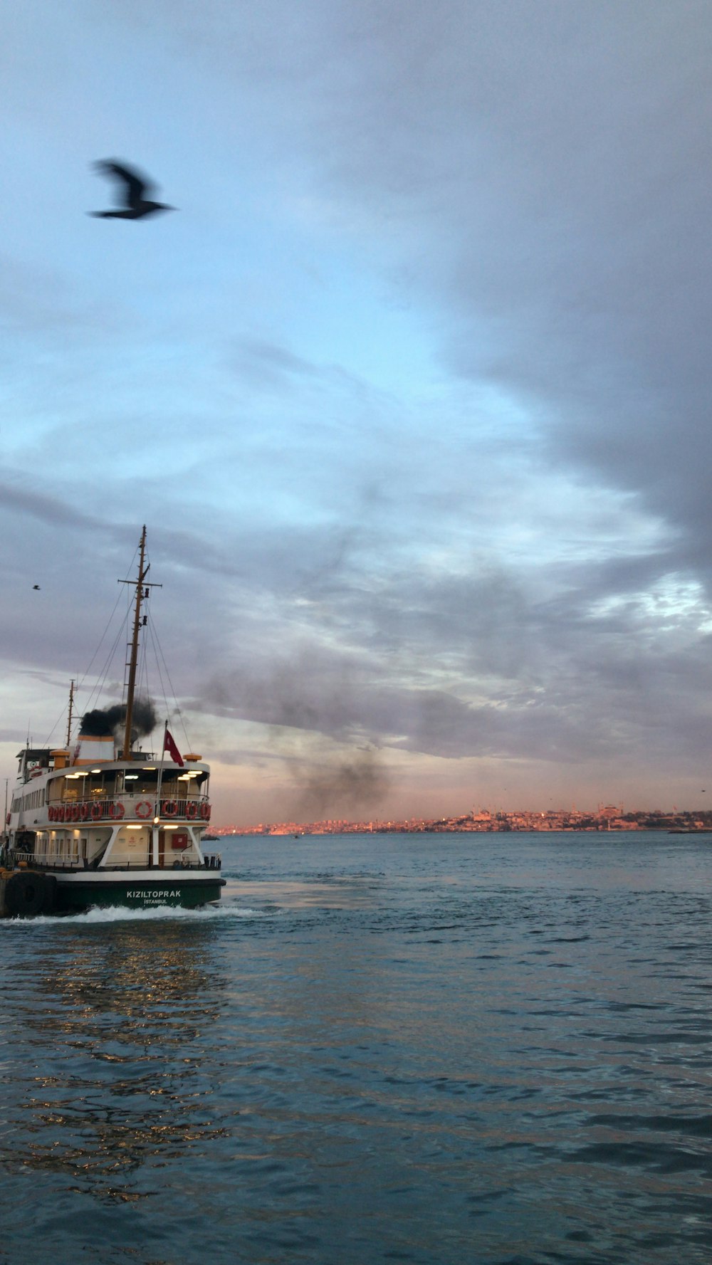 a large boat floating on top of a body of water