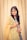 a woman in a yellow and blue sari