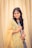 a woman in a yellow and blue sari