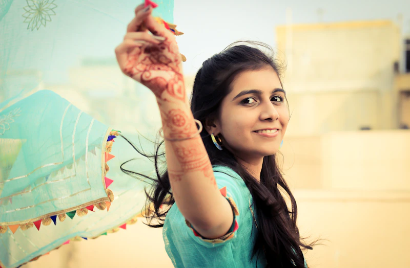 playful woman holding a kite outdoors