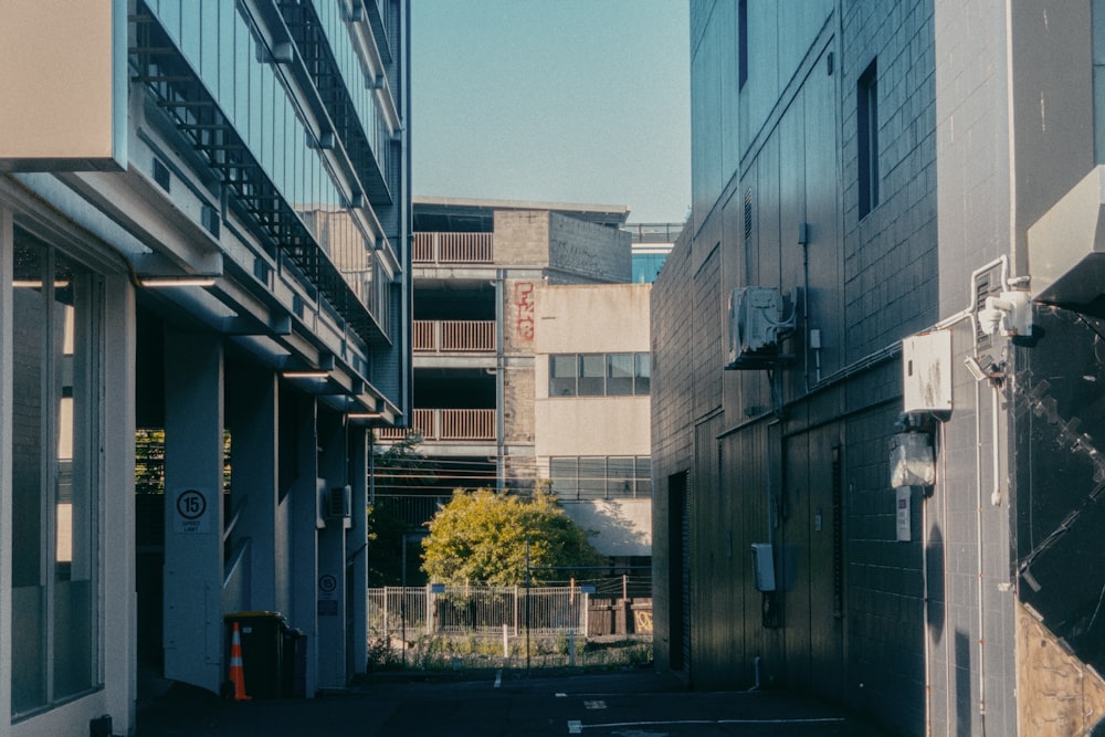 a narrow city street with buildings on both sides