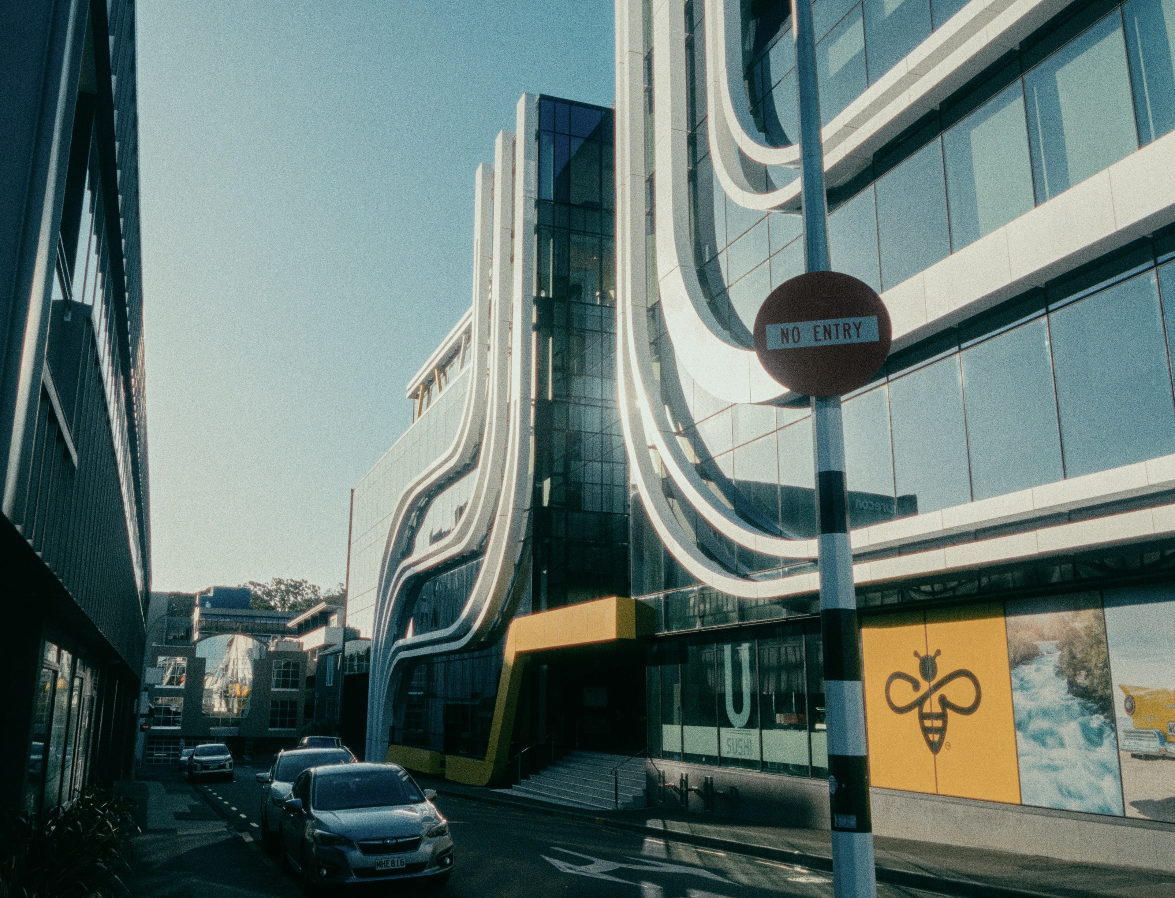 a city street with cars parked on the side of it