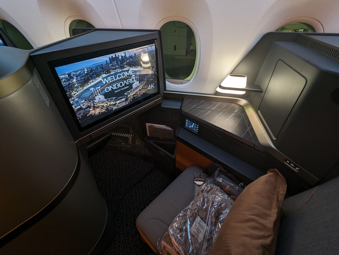 a view of the inside of an airplane with a television, 
