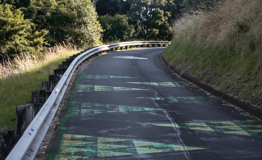 a person riding a skateboard down a road