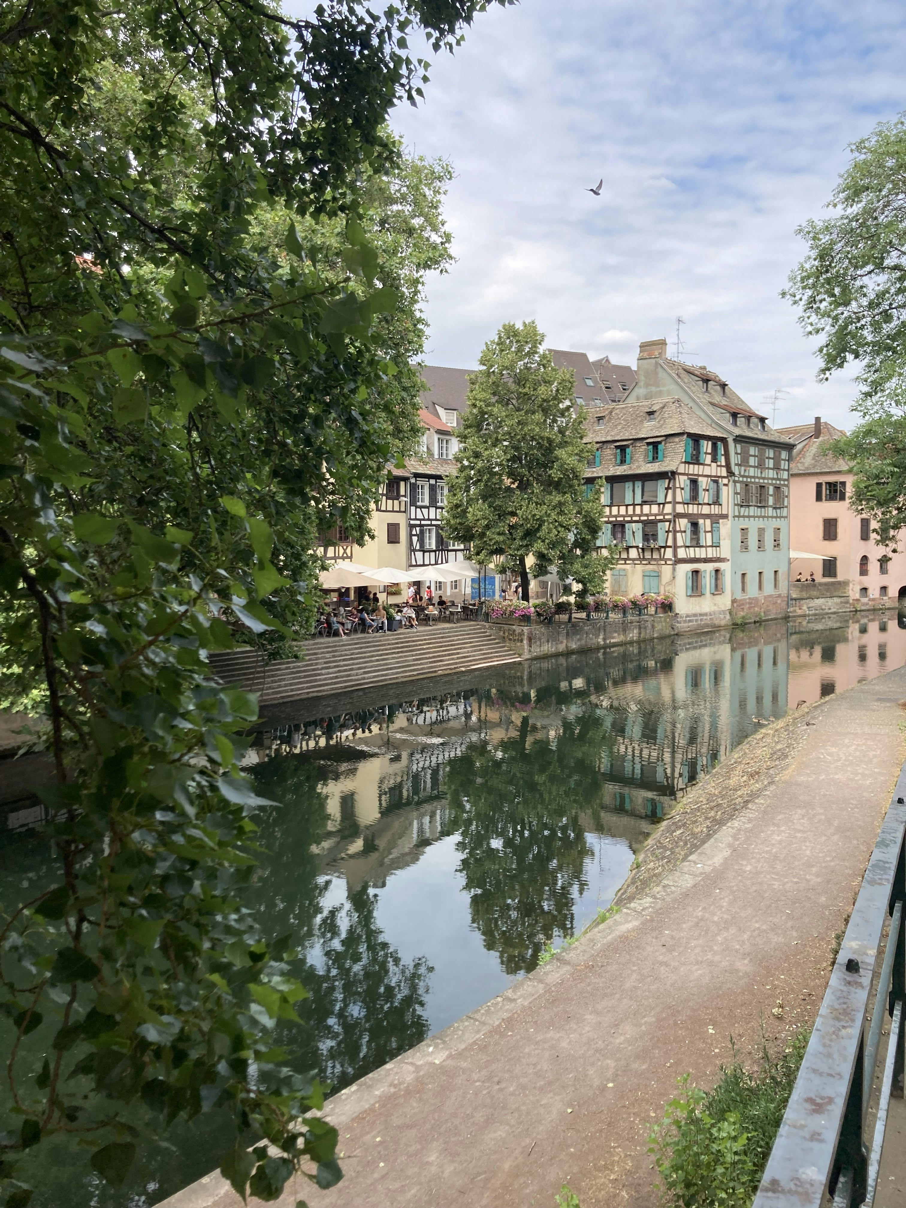 a river running through a city next to tall buildings