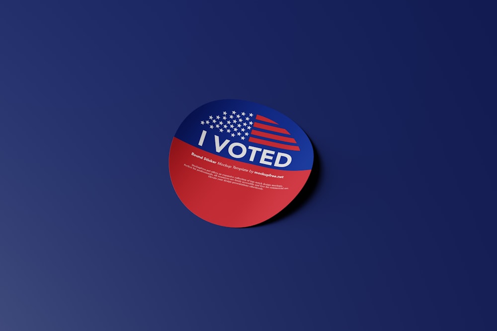 a red, white and blue sticker that says i vote