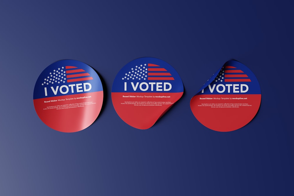 three red, white and blue stickers with the words i vote on them