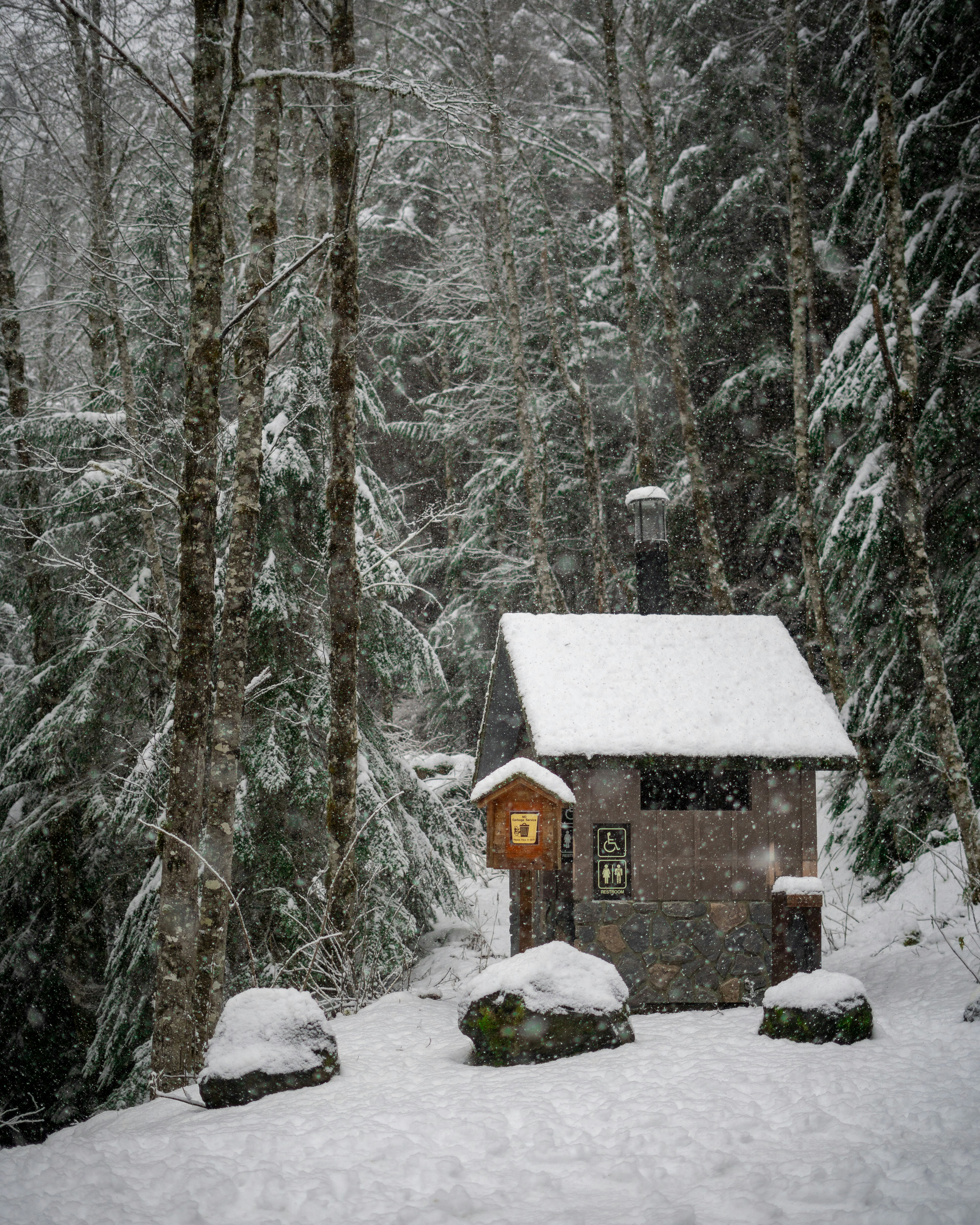 A small cabin in the middle of a snowy forest photo – Free House Image ...
