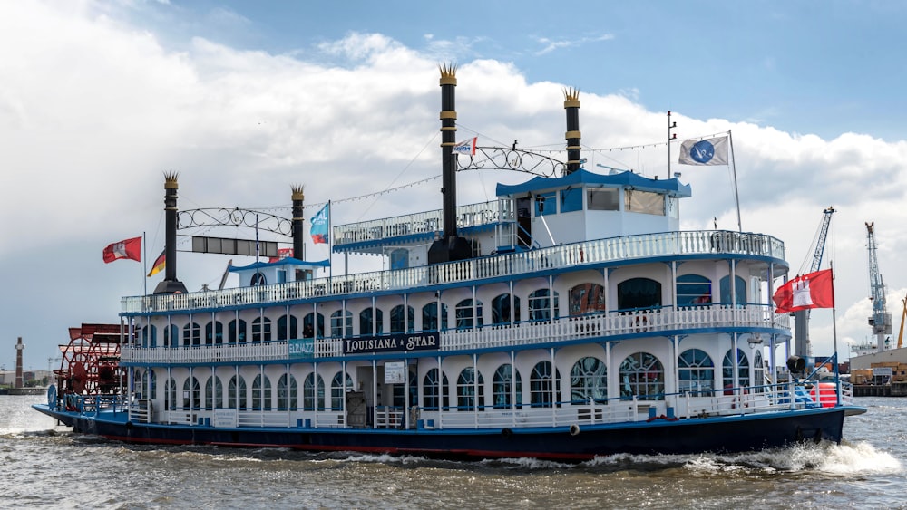 a large blue and white boat on a body of water