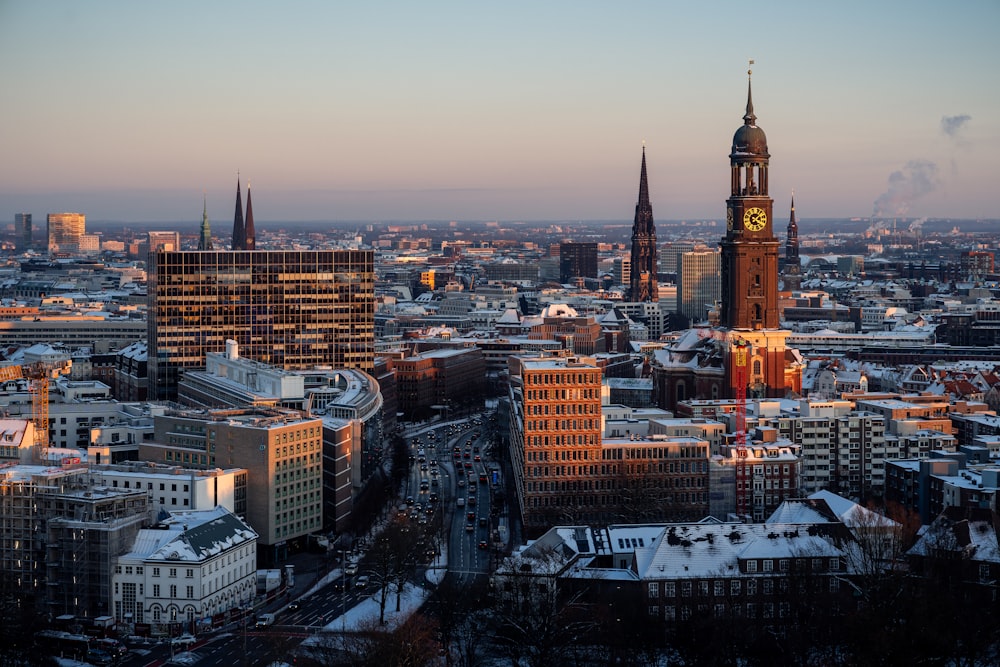 a view of a city with tall buildings and a clock tower