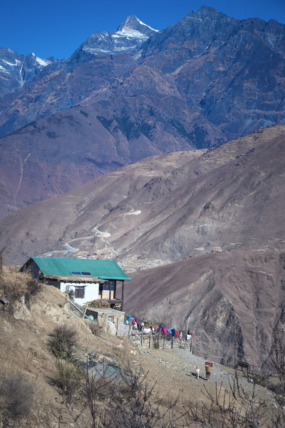 a group of people standing on top of a mountain