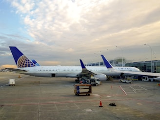 a large jetliner sitting on top of an airport tarmac