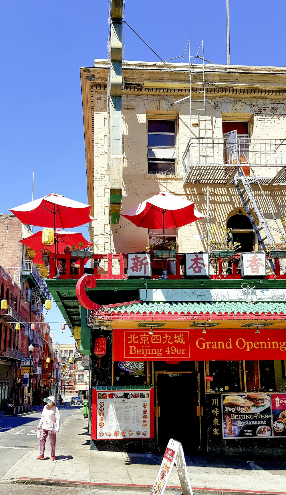 a store with red umbrellas on a city street