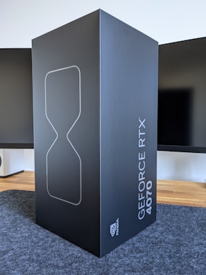 a large black box sitting on top of a carpeted floor