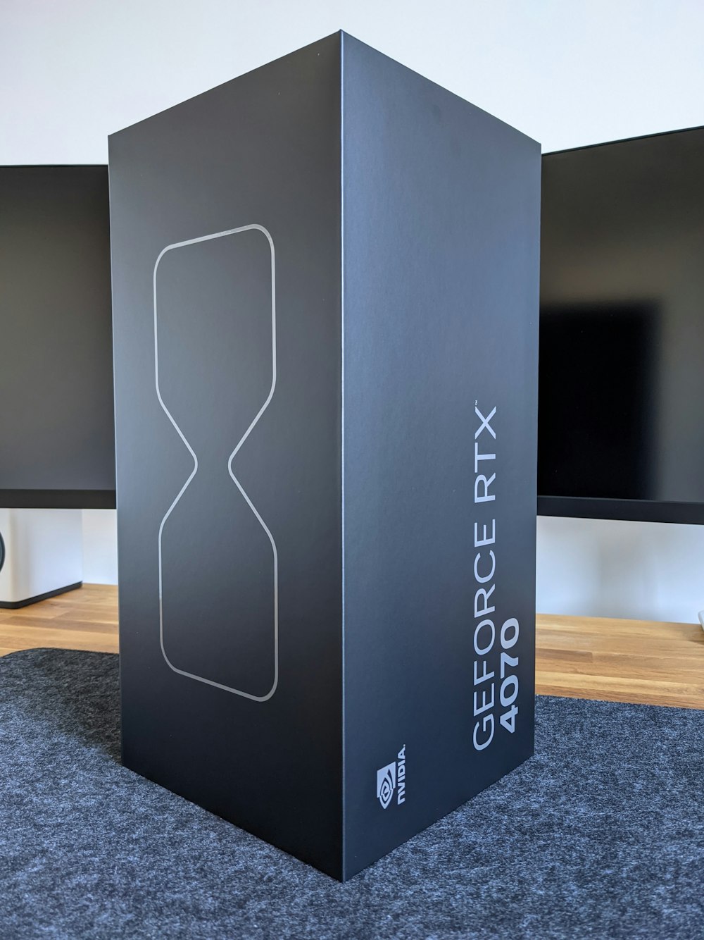 a large black box sitting on top of a carpeted floor