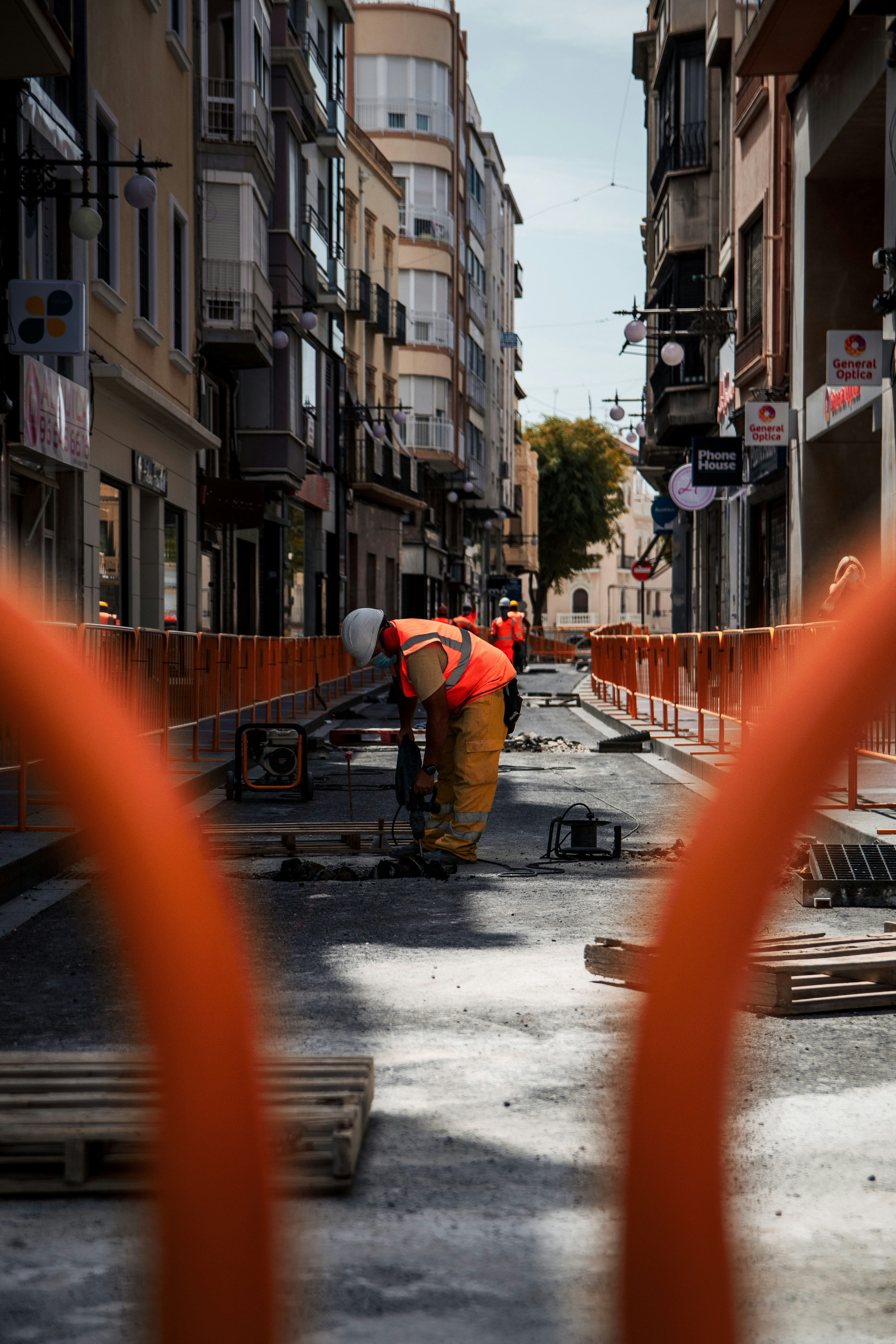 a construction worker is working on a street