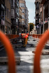 a construction worker is working on a street
