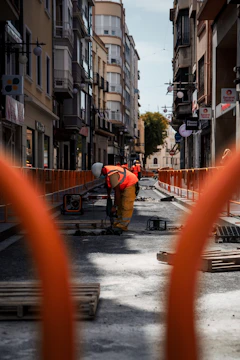 a construction worker is working on a street