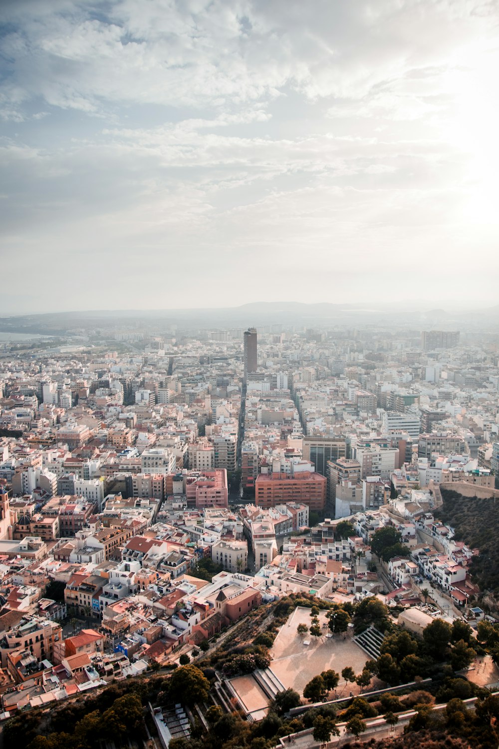 a view of a city from the top of a hill