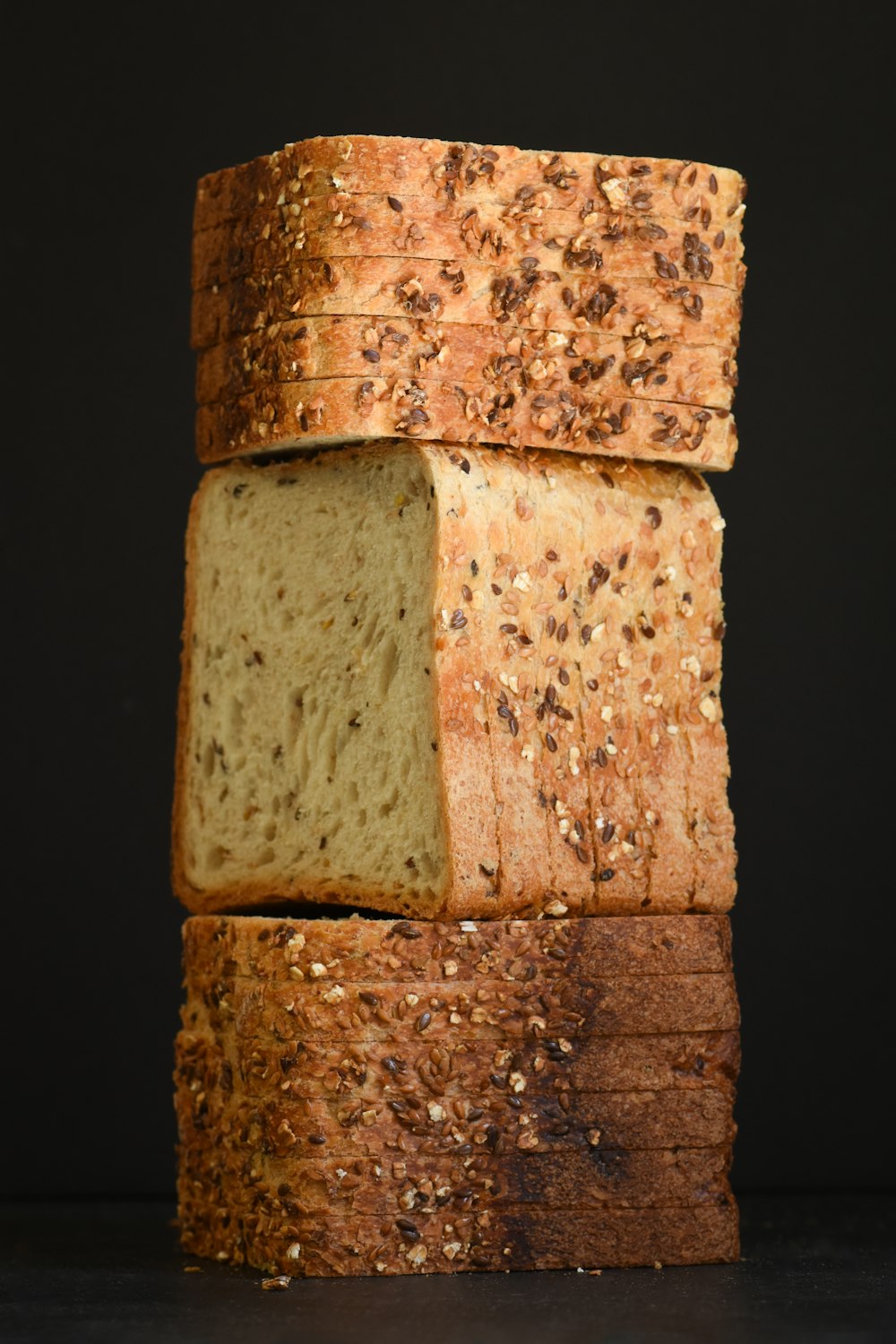 a stack of sliced bread sitting on top of a table