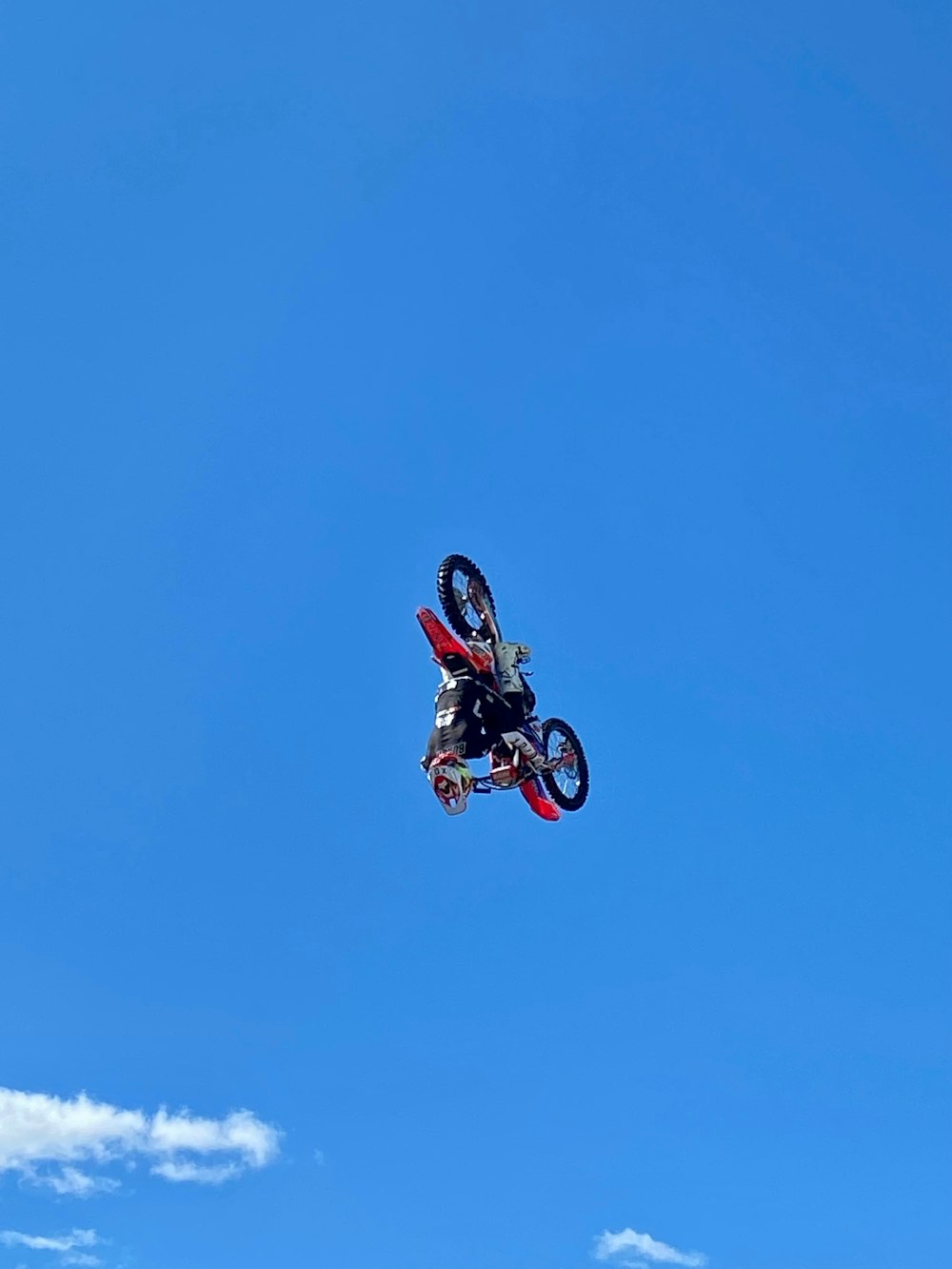 a person on a motorcycle flying through the air