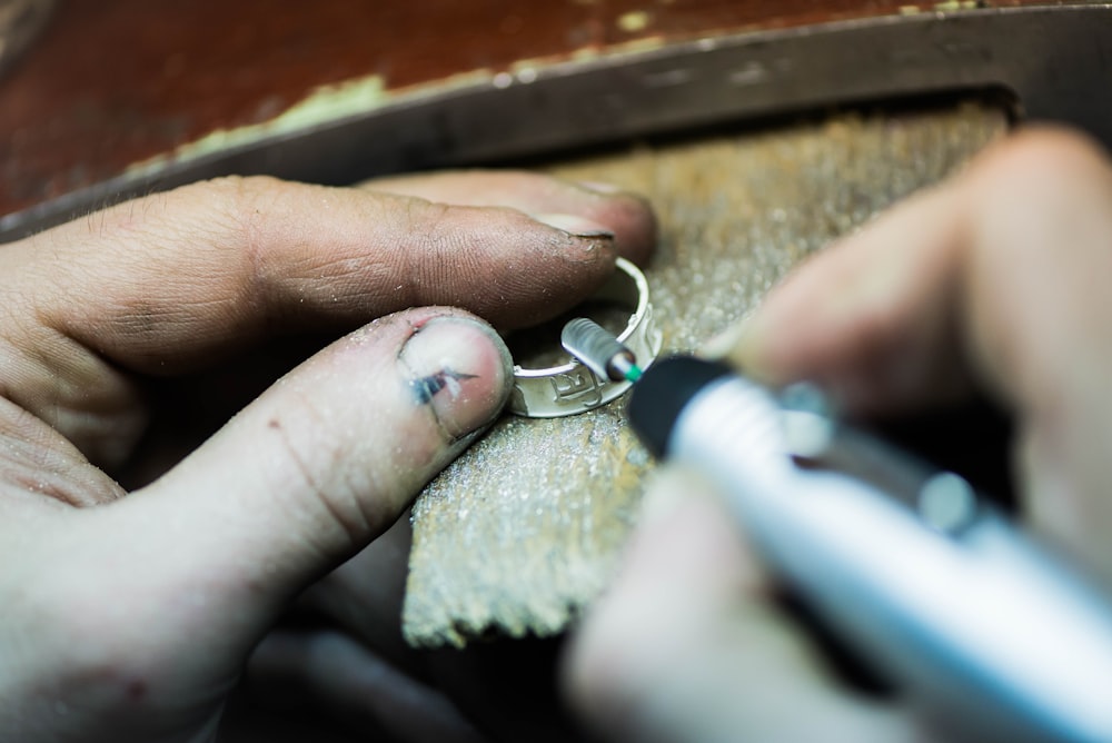 a person is putting a ring on another person's finger