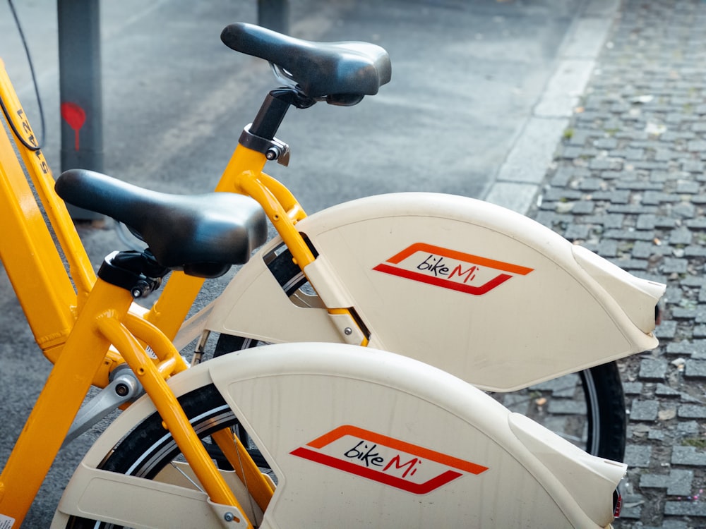 a close up of a yellow and white bike