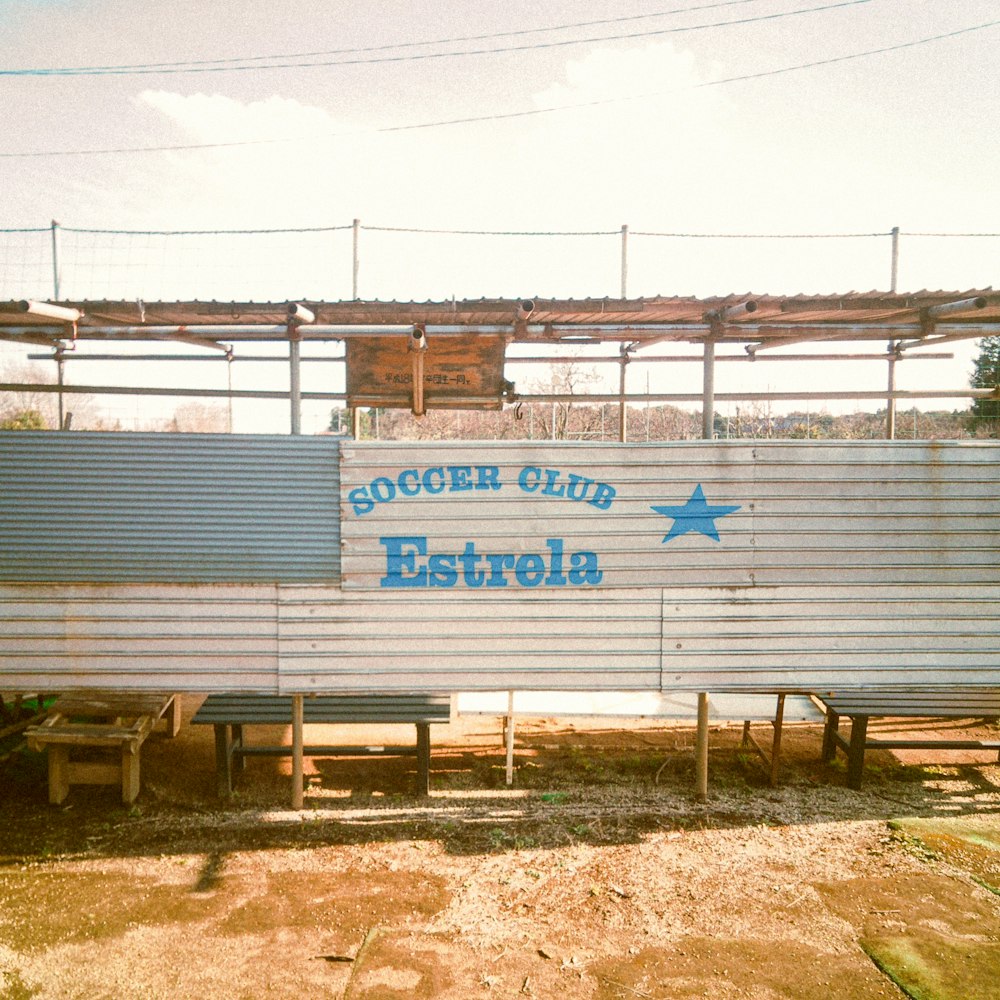 a metal structure with a sign that says soccer club estteria