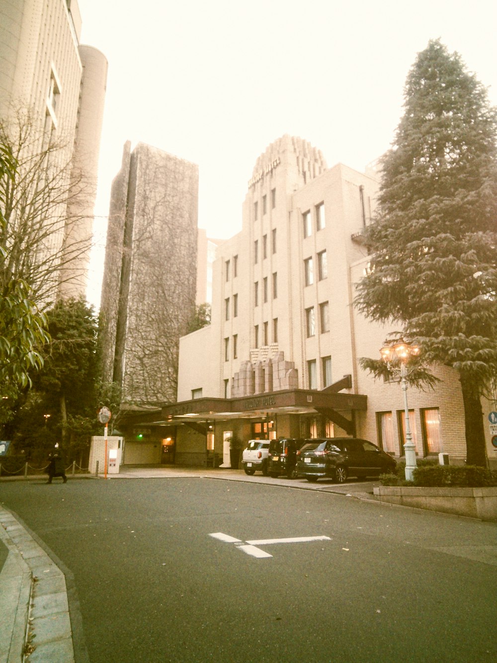 a large white building sitting on the side of a road