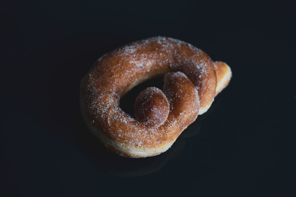 a couple of doughnuts sitting on top of a table